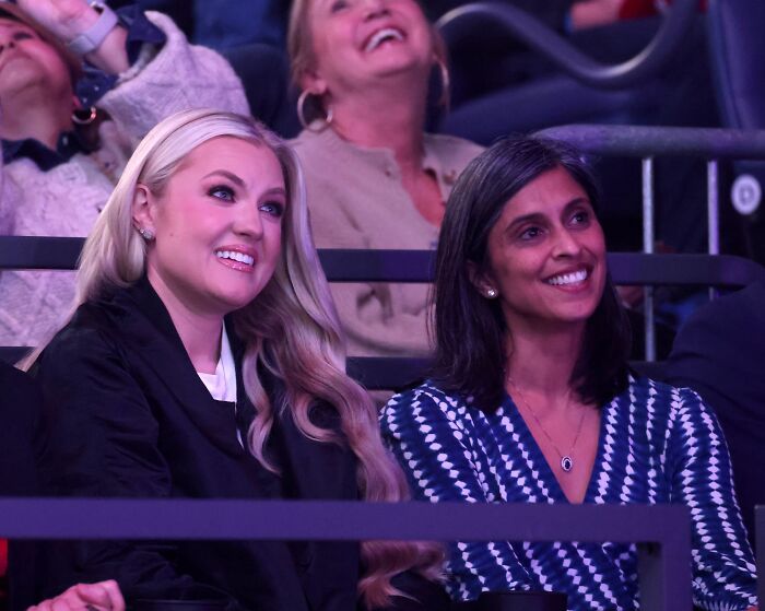 Two women smiling and seated in an audience, related to JD Vance marriage speculation and viral hug discussion. Two women smiling and seated in an audience, related to JD Vance marriage speculation and viral hug discussion.