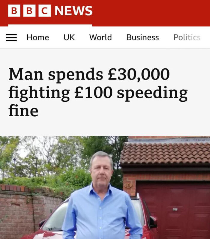 Man standing next to a car under a tiled roof garage, illustrating local newspaper headlines about unusual news stories.