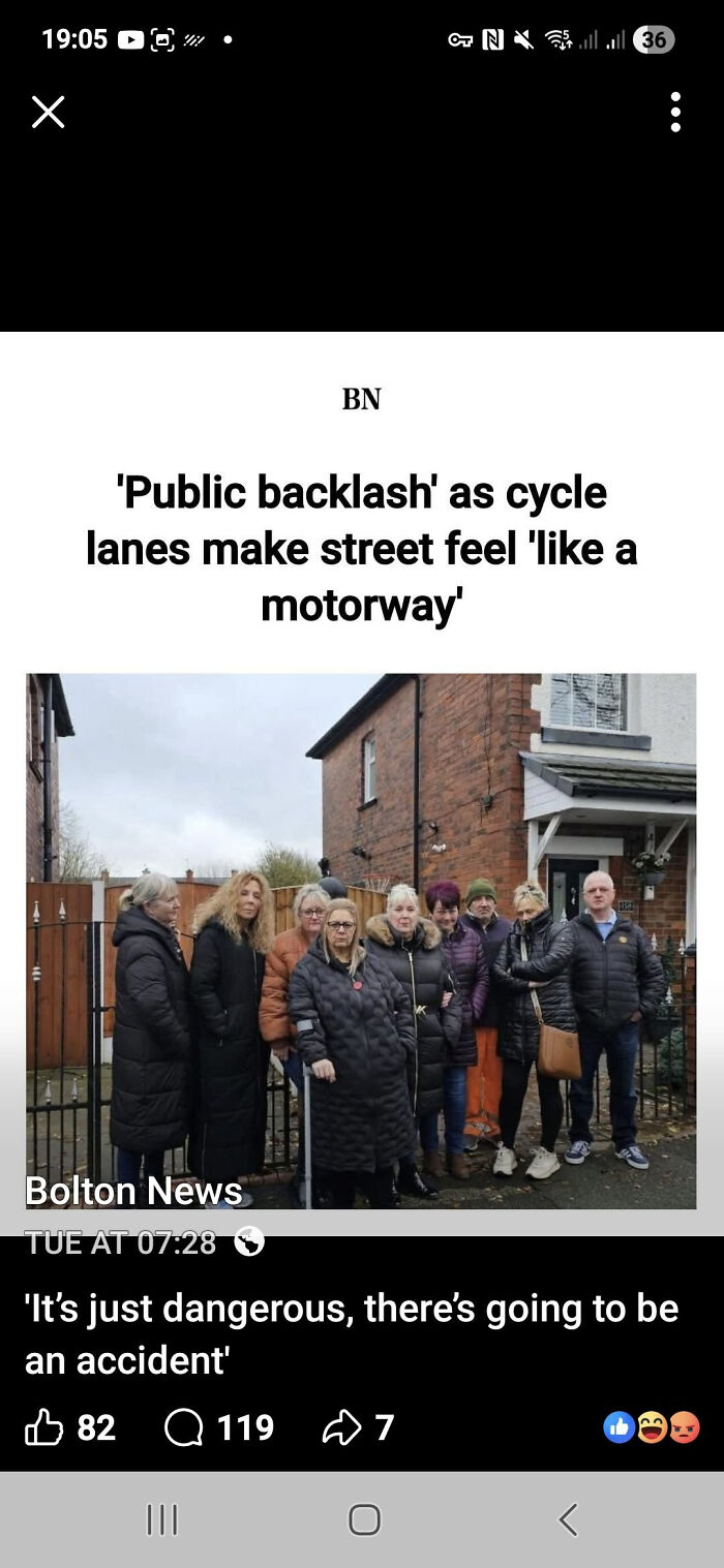 Group of residents protesting cycle lanes on street featured in local newspaper titles showing community backlash.