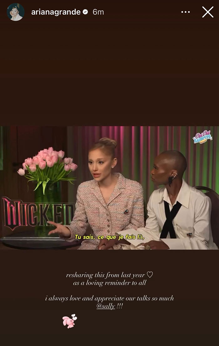 Ariana Grande in an interview setting sharing an urgent reminder about body-shaming with a fellow guest.