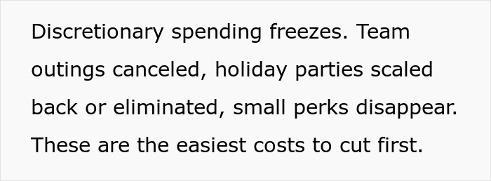 Workplace showing subtle red flags like canceled outings and cut perks indicating job safety concerns.