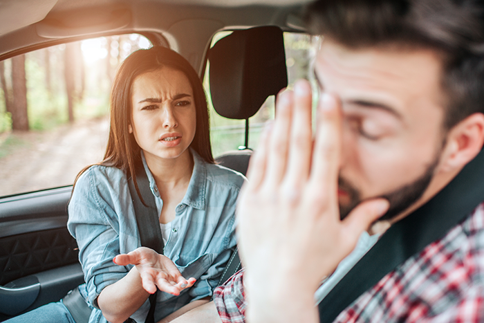 Couple arguing in a car, showing frustration and embarrassment, capturing a moment of tension and hunger conflict. Couple arguing in a car, showing frustration and embarrassment, capturing a moment of tension and hunger conflict.