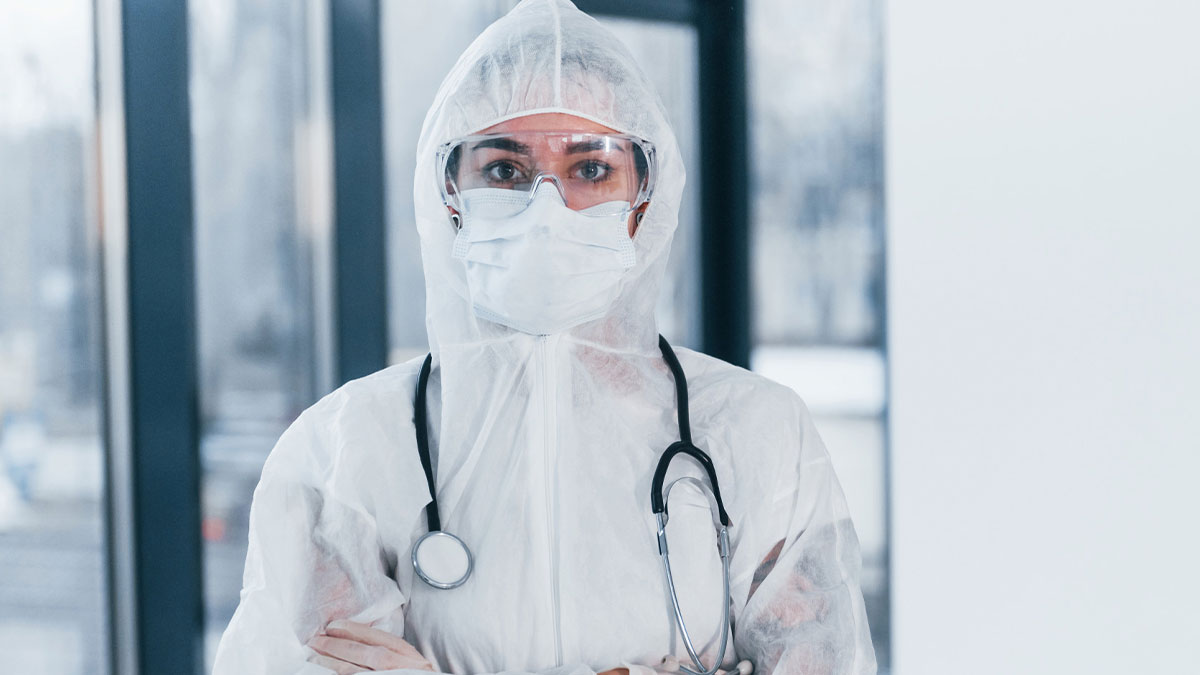 Healthcare worker in protective gear with stethoscope, representing biggest bullet dodged in medical setting.