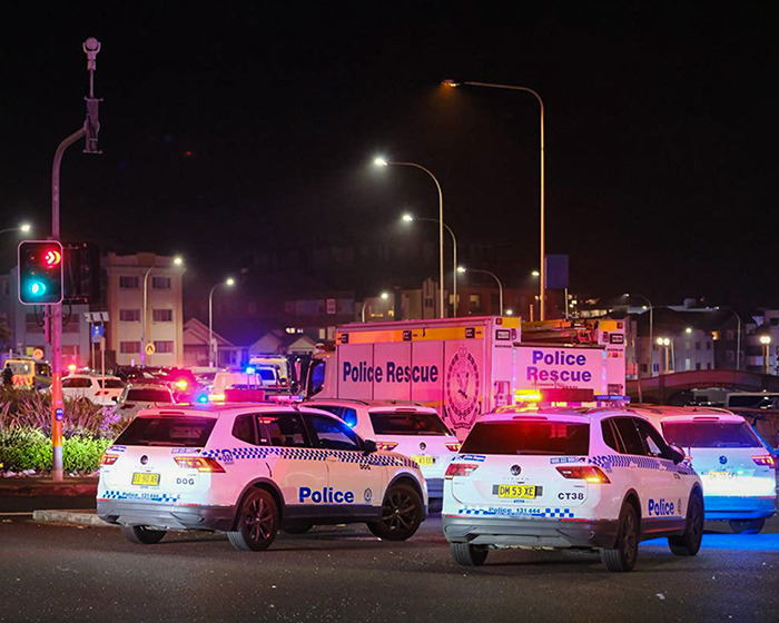 Police rescue vehicles and patrol cars at night at Bondi Beach scene following attacker confrontation and hospital visit update. Police rescue vehicles and patrol cars at night at Bondi Beach scene following attacker confrontation and hospital visit update.