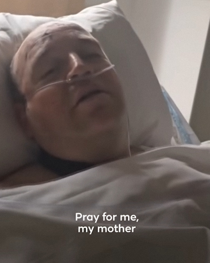 Man lying in hospital bed with nasal oxygen tube, appearing weak after Bondi Beach hero's hospital visit update. Man lying in hospital bed with nasal oxygen tube, appearing weak after Bondi Beach hero's hospital visit update.