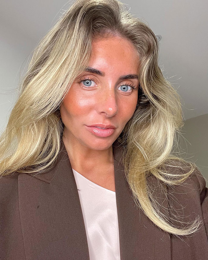 Woman with blonde hair wearing a brown blazer, representing the snitch who reported Bonnie Blue to cops facing prison. Woman with blonde hair wearing a brown blazer, representing the snitch who reported Bonnie Blue to cops facing prison.