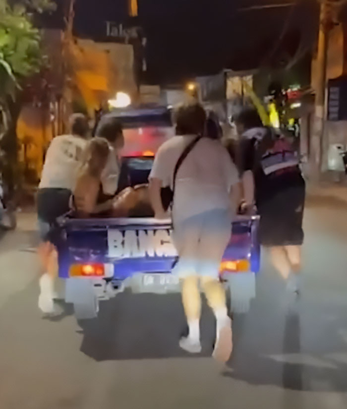 Group of people pushing a vehicle at night, illustrating the snitch who reported Bonnie Blue to cops concept. Group of people pushing a vehicle at night, illustrating the snitch who reported Bonnie Blue to cops concept.