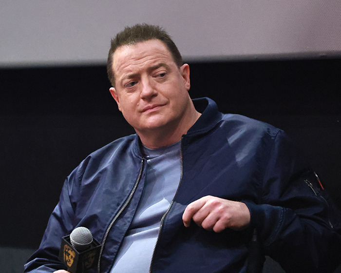 Brendan Fraser wearing a navy jacket, holding a microphone, sharing heartbreaking truth about his career after Oscar victory. Brendan Fraser wearing a navy jacket, holding a microphone, sharing heartbreaking truth about his career after Oscar victory.