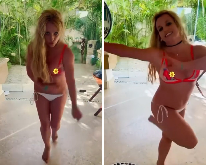 Britney Spears in a red bikini experiencing a slip and sharing a yacht kiss with a mystery man outdoors. Britney Spears in a red bikini experiencing a slip and sharing a yacht kiss with a mystery man outdoors.