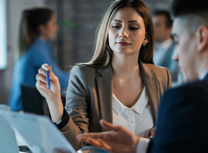 Woman weirded out at work as coworker insists on calling her his work mom during office meeting.