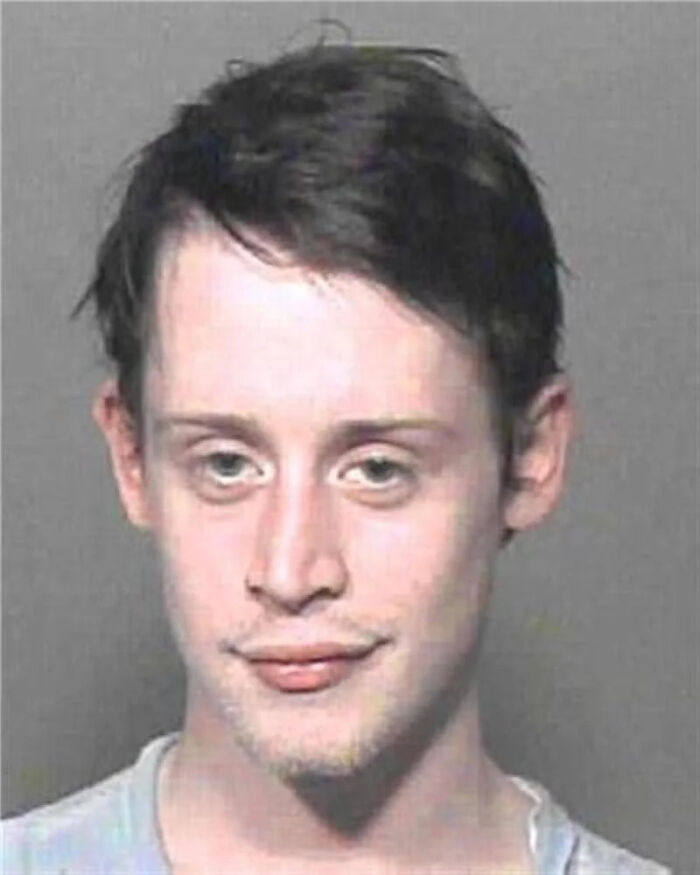 Mugshot of a young male celebrity with dark hair, part of infamous celebrity mugshots collection.