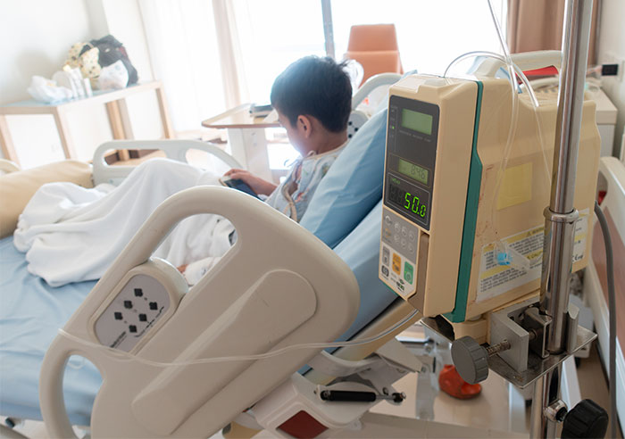 Child recovering in hospital bed after accidentally eating gummies, highlighting mom calls 911 and arrest debate online. Child recovering in hospital bed after accidentally eating gummies, highlighting mom calls 911 and arrest debate online.