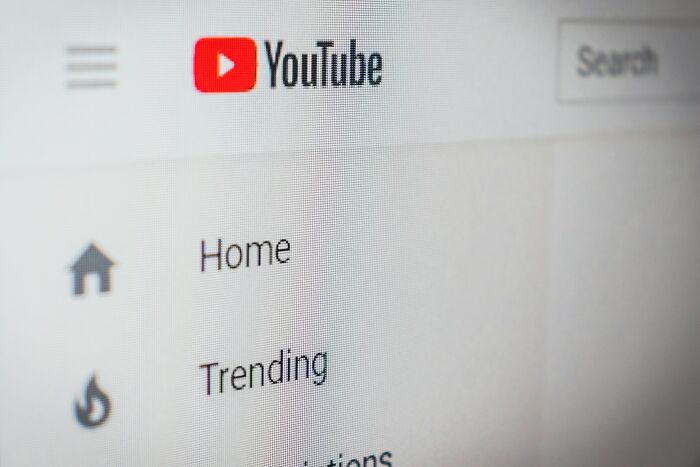YouTube homepage interface showing menu options including Home and Trending on a computer screen.