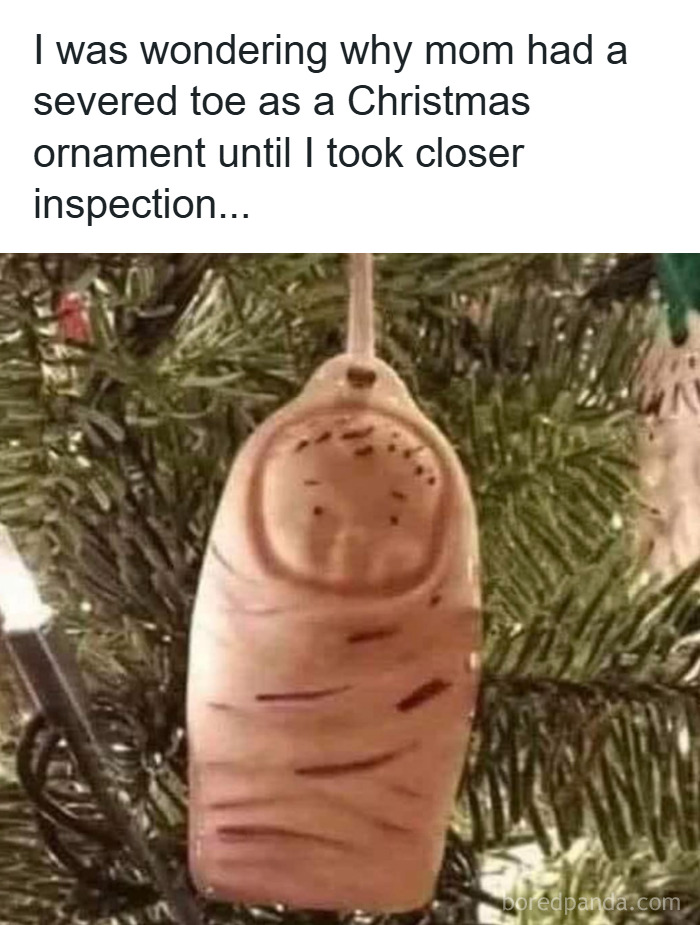 Severed toe Christmas ornament hanging on a tree, part of funny Christmas memes about unusual holiday decorations.