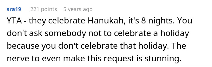 Screenshot of a Reddit comment criticizing a dad demanding family skip Hanukkah gifts due to his son's tantrum and being spoiled.
