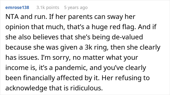 Text comment discussing issues with refusing to buy an engagement ring during financial hardship and relationship concerns. Text comment discussing issues with refusing to buy an engagement ring during financial hardship and relationship concerns.