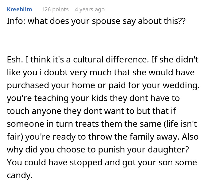 Comment discussing cultural differences and family conflict over children refusing hugs and punishment related to candy. Comment discussing cultural differences and family conflict over children refusing hugs and punishment related to candy.