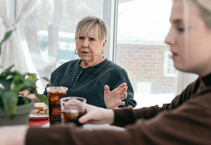Older woman expressing frustration to younger woman during tense conversation, illustrating worst mother-in-law stories from 2025.