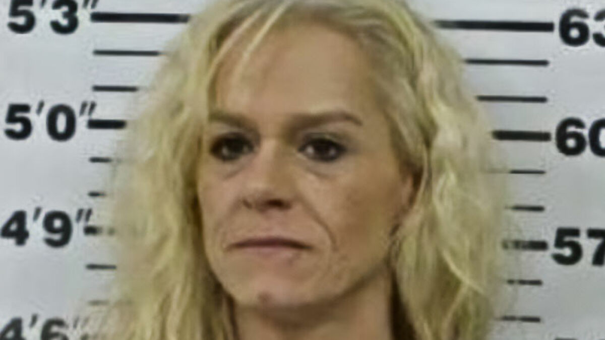 Woman with blonde hair in a mugshot photo after mom calls 911 when kids eat her gummies causing arrest debate