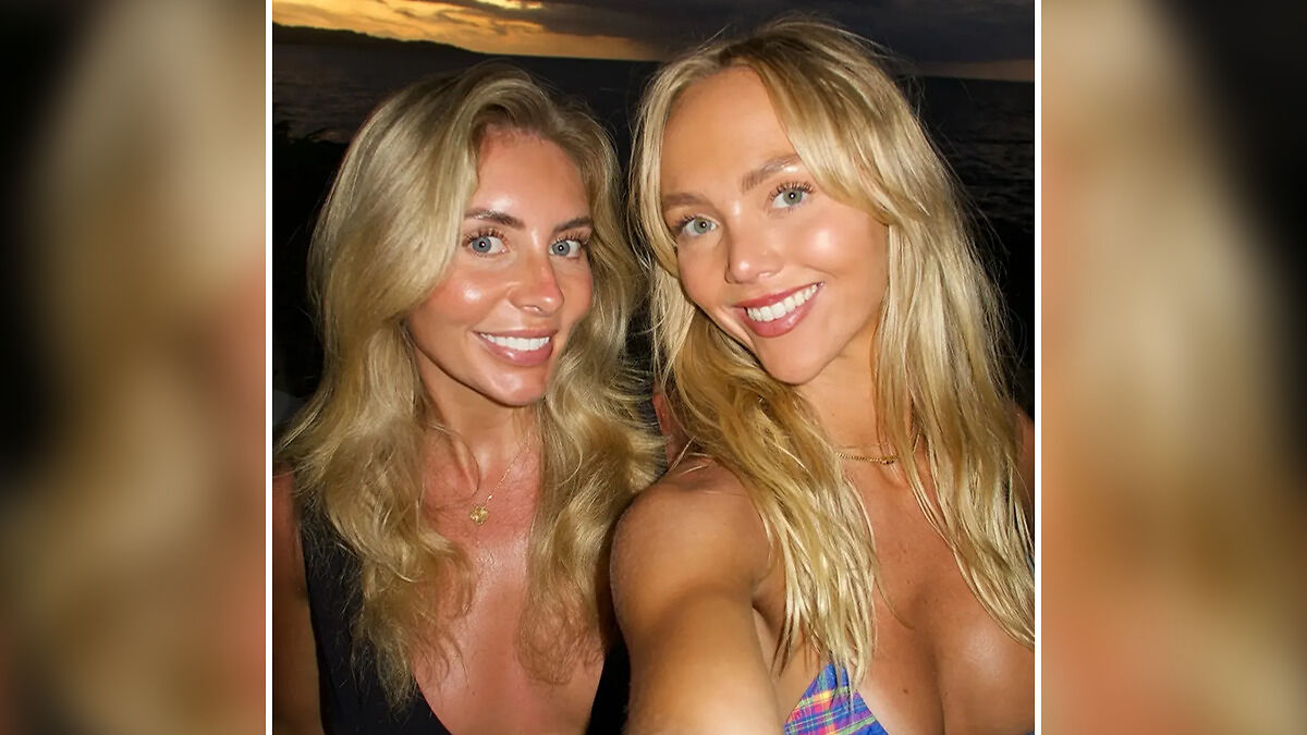 Two adult stars smiling for a selfie at sunset, highlighting Annie Knight's brutal response to Bonnie Blue's arrest news.