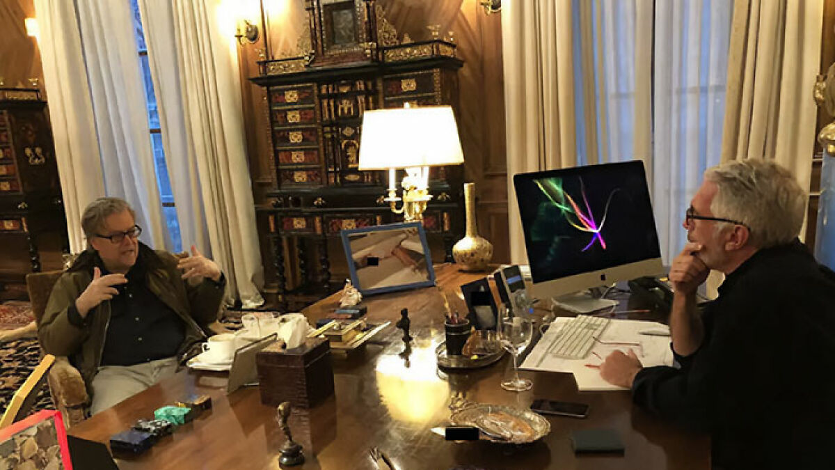 Two men in a richly decorated room with a large desk featuring disturbing Epstein estate photo and estate images.