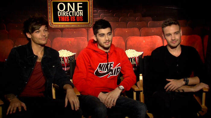 Three celebrities sitting in a theater setting with popcorn, highlighting moments when mere mortals ran into different celebrities.