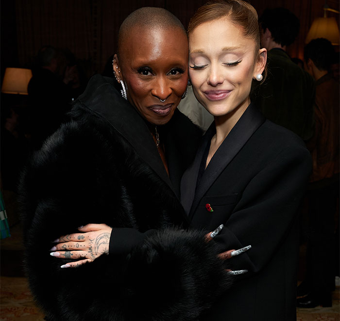 Two women embracing at an event, highlighting media bias and racial double standards debate in a viral video context. Two women embracing at an event, highlighting media bias and racial double standards debate in a viral video context.