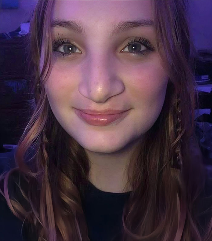 Close-up of a teenage girl with long hair and light makeup, related to teen boys setting 14YO girl on fire story.