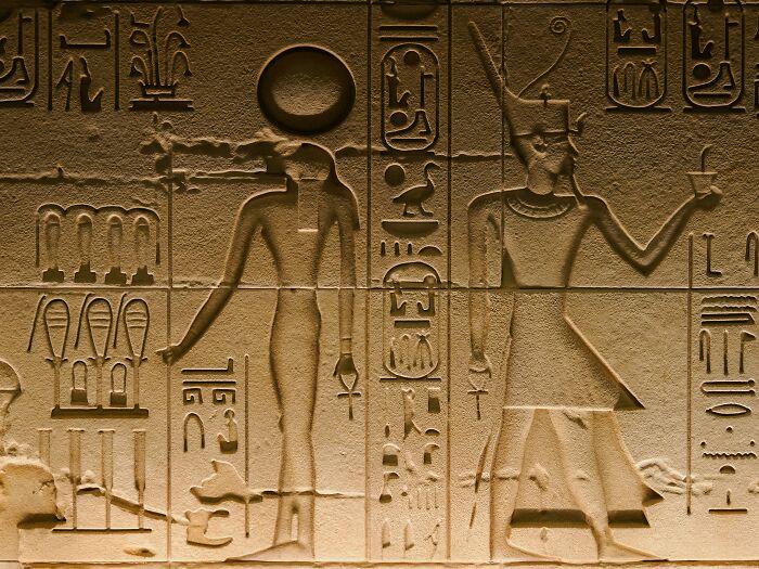 Ancient Egyptian hieroglyphs carved in stone depicting figures and symbols, illustrating crazy facts shared online. Ancient Egyptian hieroglyphs carved in stone depicting figures and symbols, illustrating crazy facts shared online.