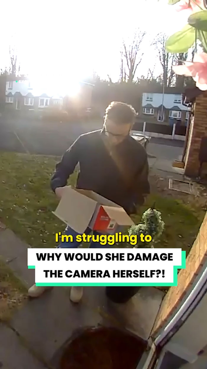 Delivery driver holding a damaged Christmas gift box outside a house, caught on security camera footage. Delivery driver holding a damaged Christmas gift box outside a house, caught on security camera footage.