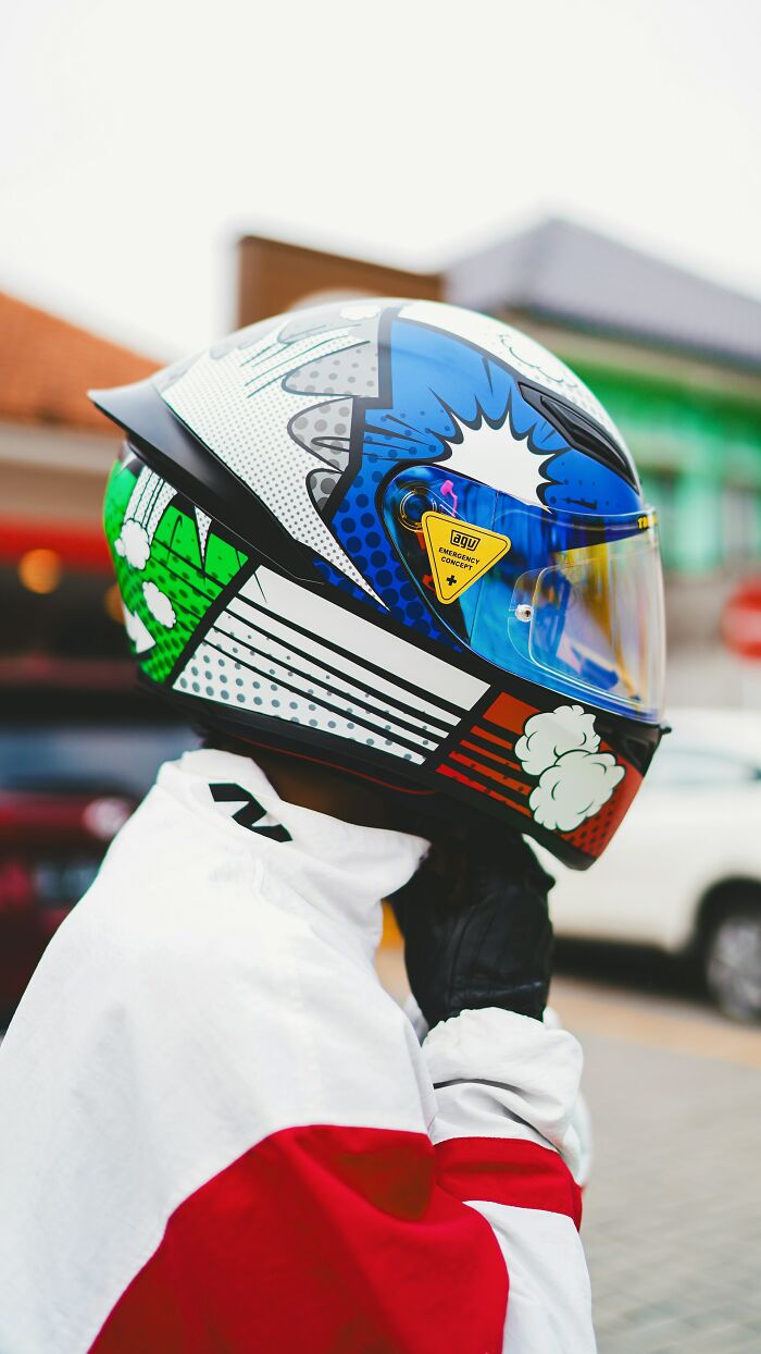 Colorful motorcycle helmet with comic book style design as an unusual personal belonging left at a lost and found.