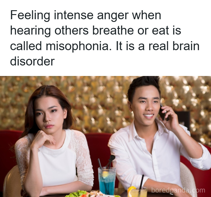 Woman showing signs of misophonia, a psychology fact about intense anger triggered by eating or breathing sounds.