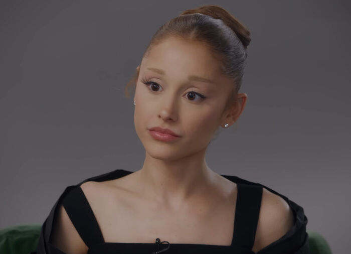 Ariana Grande in a black outfit during an interview as family member discusses her struggles and not being in a healthy place. Ariana Grande in a black outfit during an interview as family member discusses her struggles and not being in a healthy place.