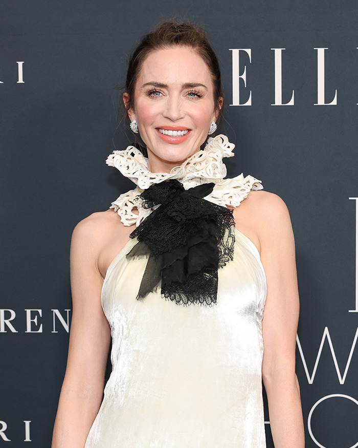 Emily Blunt smiling in a cream dress with lace details, fueling plastic surgery rumors after podcast appearance. Emily Blunt smiling in a cream dress with lace details, fueling plastic surgery rumors after podcast appearance.
