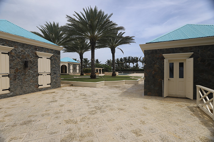Eerie new images from Epstein’s private island home showing stone buildings with blue roofs and tall palm trees outside Eerie new images from Epstein’s private island home showing stone buildings with blue roofs and tall palm trees outside