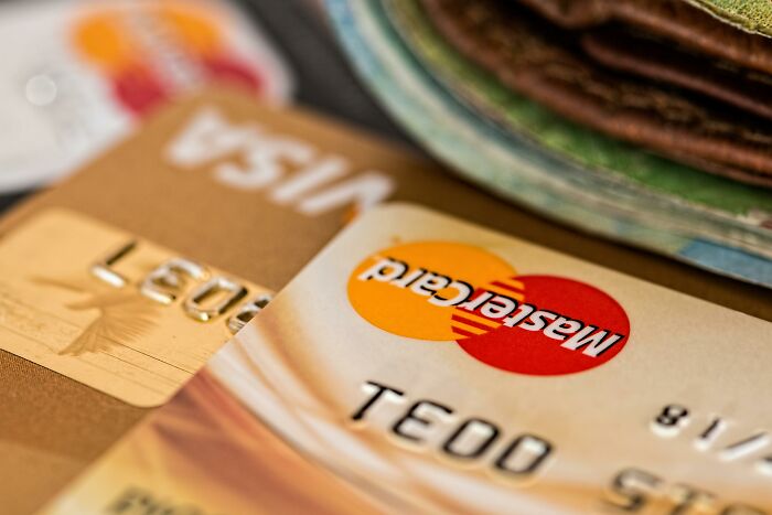 Close-up of credit cards and cash, symbolizing financial dilemmas to test your moral compass and decision-making.