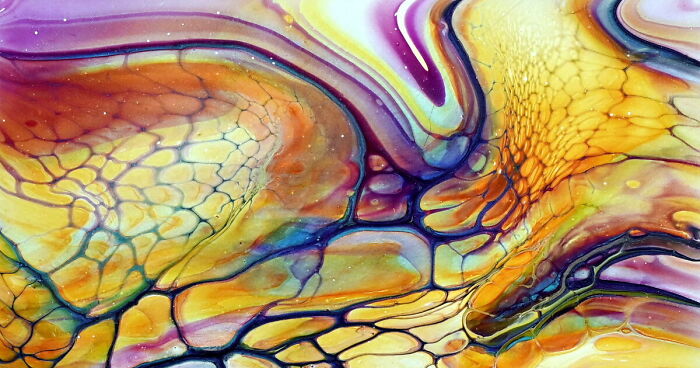 Abstract acrylic pour artwork with vibrant bloom transfer and a gorgeous color combo featuring yellow, orange, purple, and blue hues.