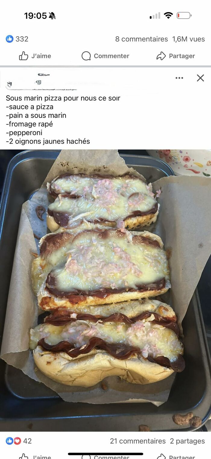 Three homemade submarine pizza sandwiches with melted cheese, pepperoni, and chopped onions in a baking tray.
