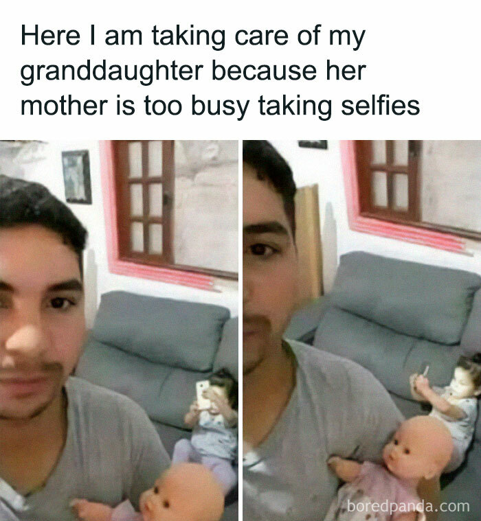 Man holding a doll while his granddaughter takes selfies in the background, a relatable meme for parents.