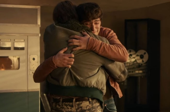 Two people hugging emotionally, capturing a heartfelt moment from Stranger Things Season 5 watching experience.