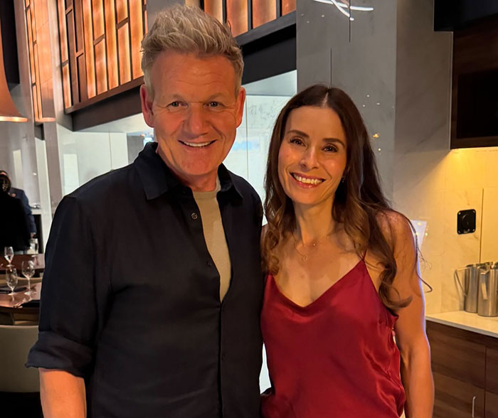 Gordon Ramsay smiling with daughter at wedding reception after aunt’s controversial text about speech.