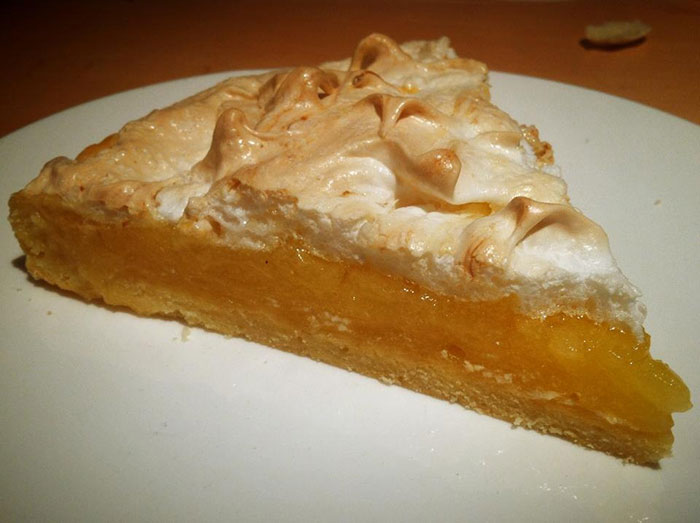 Slice of lemon meringue pie on a plate, highlighting boyfriend's passion for pastries in a relationship context. Slice of lemon meringue pie on a plate, highlighting boyfriend's passion for pastries in a relationship context.