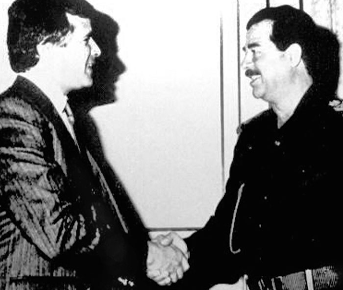 Two men shaking hands in a black and white photo illustrating bizarre facts from history and unexpected moments.