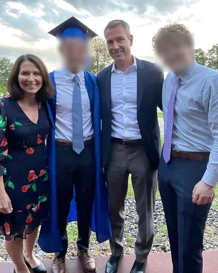 HR exec Kristin Cabot standing with three men at an outdoor event, dressed in a floral dress and smiling. HR exec Kristin Cabot standing with three men at an outdoor event, dressed in a floral dress and smiling.