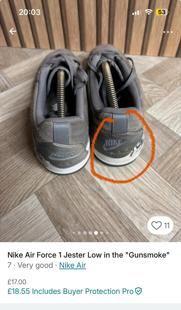 Worn Nike Air Force 1 sneakers with orange circle highlighting damaged heel area on wood floor background on Vinted listing.