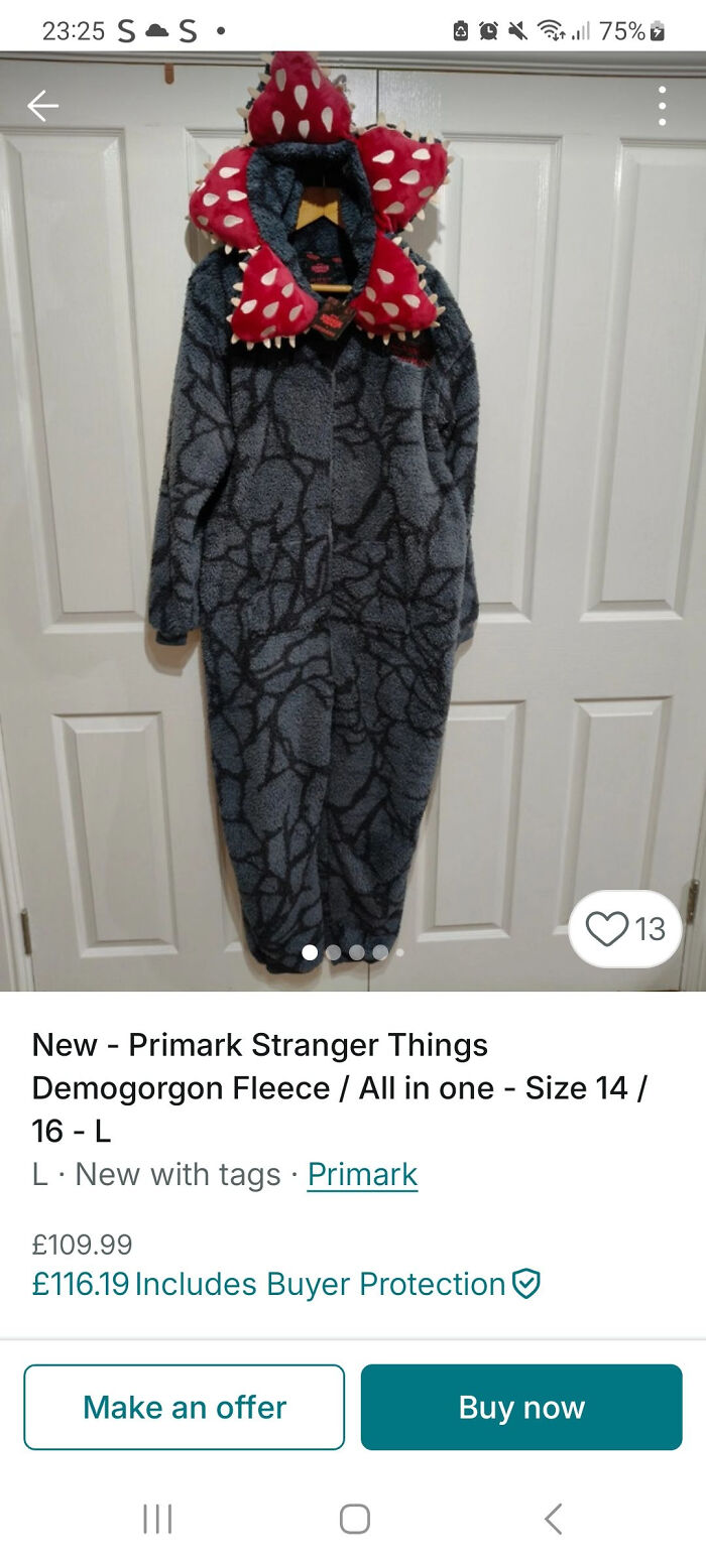 Primark Stranger Things Demogorgon fleece all-in-one costume hanging against white doors on Vinted listing.