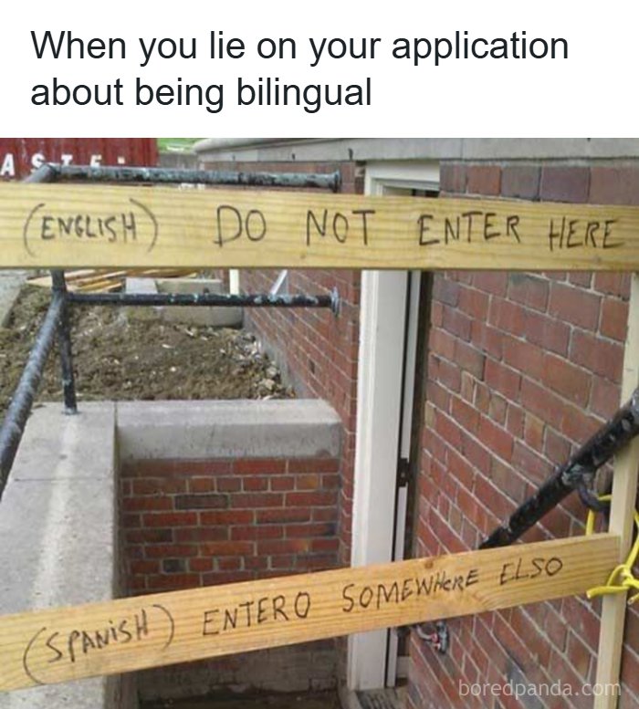 Humorous dad joke showing a bilingual sign with incorrect Spanish translation on wooden planks at a construction site.
