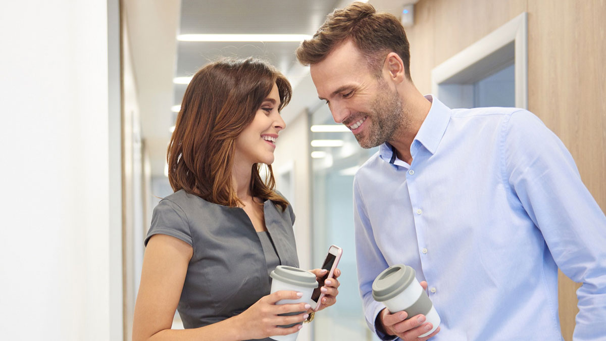 Woman refusing to be third wheel in marriage, holding coffee, confronting husband about work-wife relationship.
