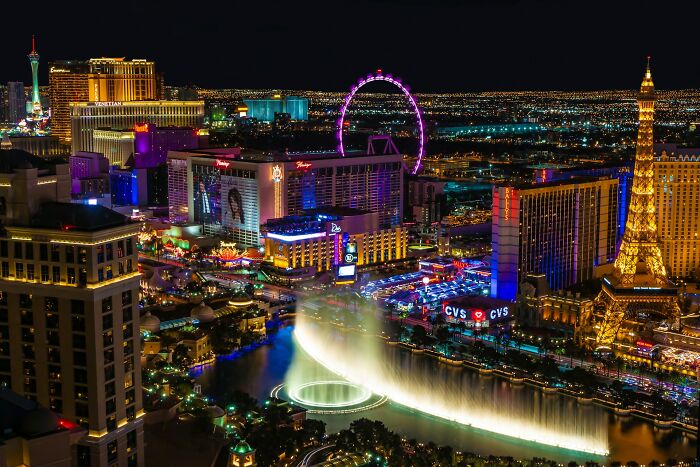 Nighttime cityscape of Las Vegas Strip with fountains and bright lights illustrating secrets people trust strangers online with.