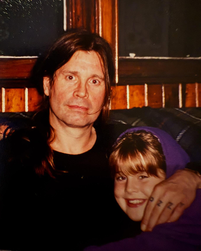 Ozzy Osbourne with a young fan in a cozy setting, highlighting fans' reactions to Kelly Osbourne's transformation.